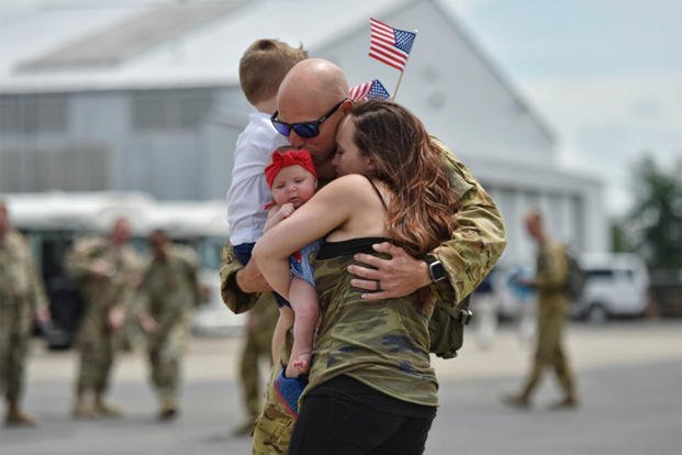 homecoming-couple-and-baby.jpg